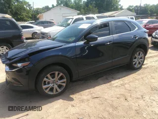 2022 Mazda CX-30 S Carbon Edition with VIN 3MVDMBCL6NM423255, listed as a IAAI auction lot 42209829 with 51,589 mi miles and . Bid and sale history available at DreamBid. Image 17.