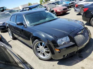 2005 Chrysler 300 with VIN 2C3JA43R95H161005, listed as a Copart auction lot 60951874 with 147,903 mi miles and Salvage Title. Bid and sale history available at carsss.com. Image 4.