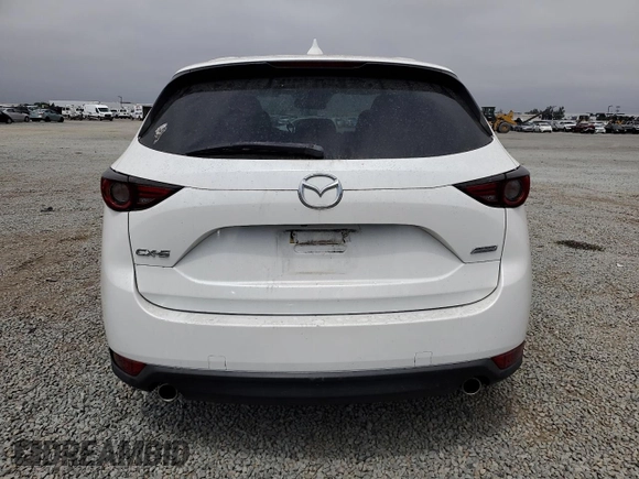 2018 Mazda CX-5 Grand Touring with VIN JM3KFADMXJ1358221, listed as a Copart auction lot 59746545 with 54,094 mi miles and Salvage title. Bid and sale history available at DreamBid. Image 6.