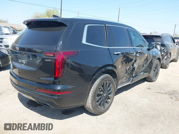 2021 Cadillac XT6 Premium Luxury z VIN 1GYKPCRS9MZ221232, wystawiony jako IAAI lot #41783431 z przebiegiem 69 367 mil mil oraz . Historia ofert i sprzedaży dostępna na DreamBid. Obrazek 4.