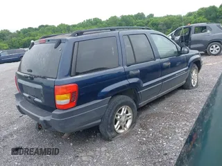 2003 Jeep Grand Cherokee Laredo with VIN 1J4GW48S63C591605, listed as a IAAI auction lot 42389898 with 177,024 mi miles and . Bid and sale history available at DreamBid. Image 4.