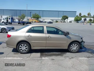 2010 Toyota Corolla with VIN 1NXBU4EE1AZ310799, listed as a IAAI auction lot 42672763 with 174,970 mi miles and . Bid and sale history available at DreamBid. Image 14.