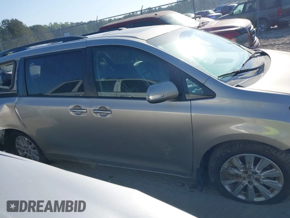 2015 Toyota Sienna XLE with VIN 5TDYK3DC0FS632909, listed as a IAAI auction lot 42012143 with 97,084 mi miles and . Bid and sale history available at DreamBid. Image 14.