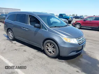 2011 Honda Odyssey EX-L with VIN 5FNRL5H61BB068512, listed as a IAAI auction lot 42582576 with 199,295 mi miles and . Bid and sale history available at DreamBid. Image 1.