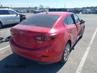 2014 Mazda 3 S Grand Touring with VIN JM1BM1W32E1107542, listed as a IAAI auction lot 42070484 with 132,395 mi miles and . Bid and sale history available at DreamBid. Image 4.