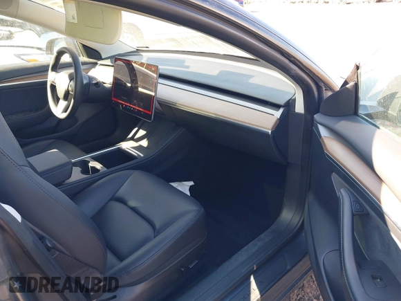2023 Tesla Model 3 with VIN 5YJ3E1EA9PF548502, listed as a IAAI auction lot 41160649 with 28,759 mi miles and . Bid and sale history available at carsss.com. Image 5.