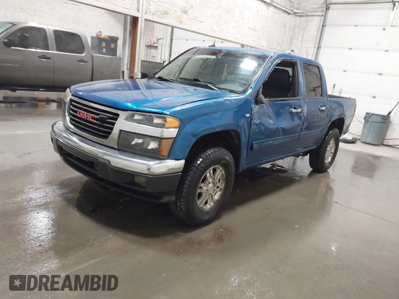 2011 GMC Canyon SLT with VIN 1GTH6NFP8B8115436, listed as a IAAI auction lot 41676023 with 148,478 mi miles. Bid and sale history available at carsss.com. Image 2.