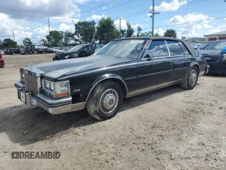 1984 Cadillac Seville z VIN 1G6AS6988EE829387, wystawiony jako Copart lot #75061224 z przebiegiem 643 mil mil oraz Szkody całkowita. Historia ofert i sprzedaży dostępna na DreamBid. Obrazek 1.