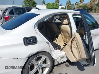2014 BMW 3 Series 320i with VIN WBA3B1G50ENN90657, listed as a IAAI auction lot 42304612 with 129,377 mi miles and . Bid and sale history available at DreamBid. Image 18.