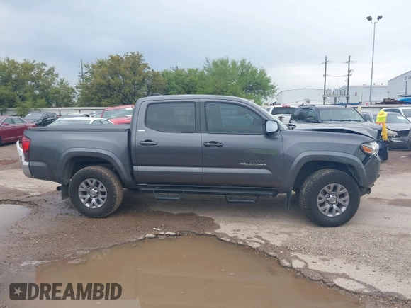 2018 Toyota Tacoma SR5 with VIN 5TFAZ5CN5JX062498, listed as a IAAI auction lot 41867393 with 128,879 mi miles and . Bid and sale history available at DreamBid. Image 14.