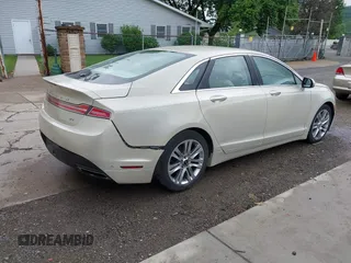 2014 Lincoln MKZ z VIN 3LN6L2G95ER808560, wystawiony jako IAAI lot #42288383 z przebiegiem 97 298 mil mil oraz . Historia ofert i sprzedaży dostępna na DreamBid. Obrazek 4.