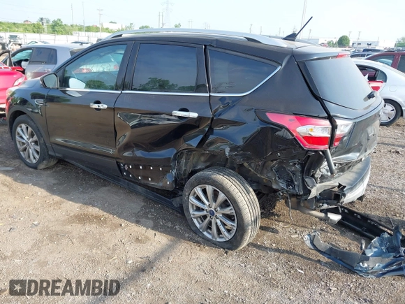 2018 Ford Escape Titanium with VIN 1FMCU9J95JUB30803, listed as a IAAI auction lot 42286536 with 63,309 mi miles and . Bid and sale history available at DreamBid. Image 3.