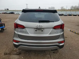 2017 Hyundai Santa Fe 2.4L z VIN 5NMZUDLB7HH030253, wystawiony jako Copart lot #51302445 z przebiegiem 136 074 mil mil oraz Szkoda całkowita • Salvage title. Historia ofert i sprzedaży dostępna na DreamBid. Obrazek 6.