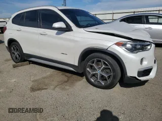 2016 BMW X1 xDrive28i z VIN WBXHT3C31GP880552, wystawiony jako Copart lot #52931305 z przebiegiem 127 225 mil mil oraz Szkoda całkowita • Salvage title. Historia ofert i sprzedaży dostępna na DreamBid. Obrazek 4.