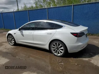 2019 Tesla Model 3 Mid Range z VIN 5YJ3E1EA0KF428001, wystawiony jako Copart lot #58480685 z przebiegiem 182 144 mil mil oraz Szkoda całkowita • Salvage title. Historia ofert i sprzedaży dostępna na DreamBid. Obrazek 2.