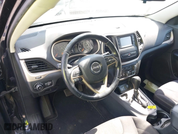 2015 Jeep Cherokee Latitude with VIN 1C4PJLCB9FW627909, listed as a IAAI auction lot 42034667 with 131,739 mi miles and . Bid and sale history available at carsss.com. Image 21.