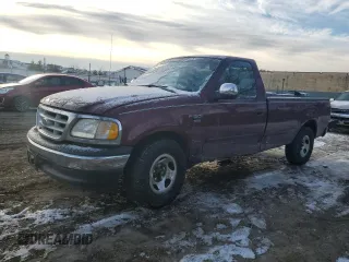 1999 Ford F-150 with VIN 1FTRF17W7XNA44872, listed as a Copart auction lot 41815695 with 182,678 mi miles and Salvage title. Bid and sale history available at DreamBid. Image 1.