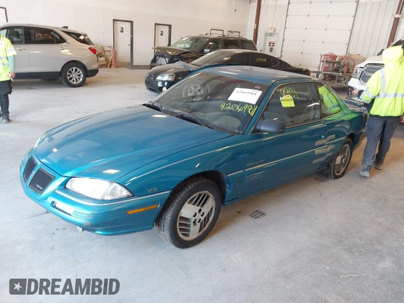 1994 Pontiac Grand Am z VIN 1G2NE15M5RM500643, wystawiony jako IAAI lot #42069901 z przebiegiem 77 129 mil mil oraz . Historia ofert i sprzedaży dostępna na DreamBid. Obrazek 2.