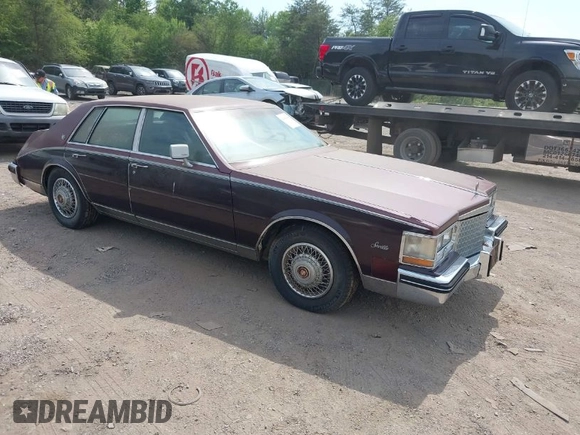 1985 Cadillac Seville z VIN 1G6KS6989FE821515, wystawiony jako IAAI lot #42009508 z przebiegiem 13 600 mil mil oraz . Historia ofert i sprzedaży dostępna na DreamBid. Obrazek 1.