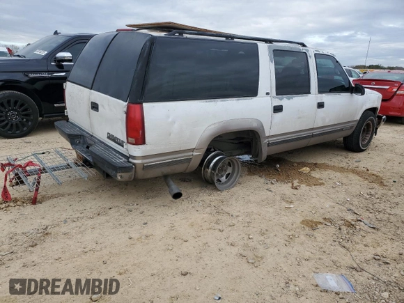 1999 Chevrolet Suburban with VIN 1GNEC16R7XJ418169, listed as a Copart auction lot 88995495 with 2,015,240 mi miles and Salvage title. Bid and sale history available at DreamBid. Image 3.