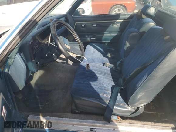 1987 Chevrolet El Camino z VIN 3GCCW80Z9HS905561, wystawiony jako Copart lot #75401604 z przebiegiem 32 958 mil mil oraz Szkoda całkowita • Salvage title. Historia ofert i sprzedaży dostępna na DreamBid. Obrazek 7.
