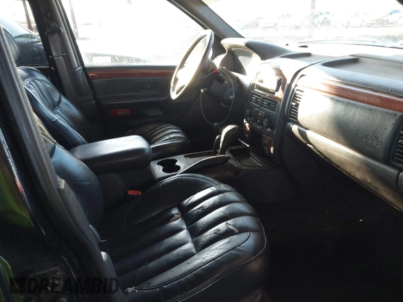 1999 Jeep Grand Cherokee Limited with VIN 1J4GW68N6XC675399, listed as a IAAI auction lot 41745815 with 217,800 mi miles. Bid and sale history available at carsss.com. Image 5.