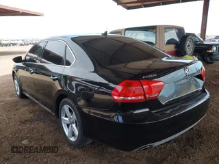 2012 Volkswagen Passat SE w/Sunroof with VIN 1VWBP7A3XCC020584, listed as a IAAI auction lot 41905793 with 138,642 mi miles. Bid and sale history available at carsss.com. Image 3.