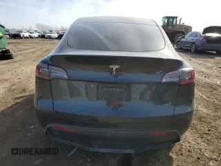 2024 Tesla Model Y with VIN 7SAYGDED7RF163537, listed as a Copart auction lot 48639255 with 7,193 mi miles and Salvage Title. Bid and sale history available at DreamBid. Image 6.