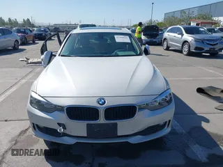 2014 BMW 3 Series 320i with VIN WBA3B1G50ENN90657, listed as a IAAI auction lot 42304612 with 129,377 mi miles and . Bid and sale history available at DreamBid. Image 13.