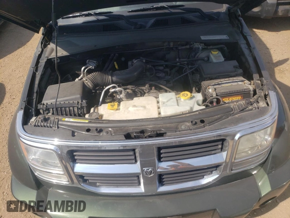 2010 Dodge Nitro SE z VIN 1D4PT2GK8AW124799, wystawiony jako Copart lot #71811164 z przebiegiem 108 013 mil mil oraz Szkoda całkowita • Salvage title. Historia ofert i sprzedaży dostępna na DreamBid. Obrazek 11.