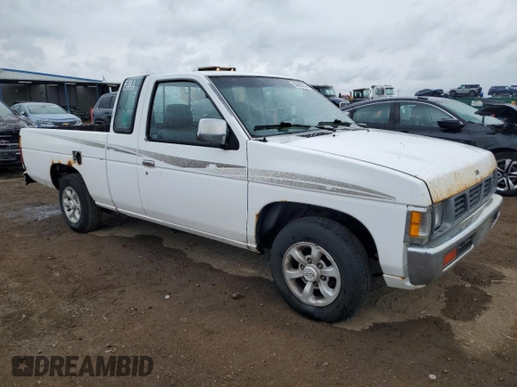 1997 Nissan Frontier XE with VIN 1N6SD16S8VC426940, listed as a Copart auction lot 55860235 with 242,265 mi miles and Salvage title. Bid and sale history available at DreamBid. Image 4.