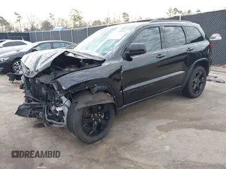 2019 Jeep Grand Cherokee Laredo E with VIN 1C4RJEAGXKC571770, listed as a IAAI auction lot 41677487 with 113,089 mi miles. Bid and sale history available at carsss.com. Image 2.