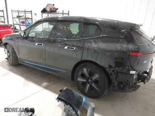 2023 BMW iX xDrive50 with VIN WB523CF04PCL15607, listed as a IAAI auction lot 41315457 with 44,058 mi miles. Bid and sale history available at carsss.com. Image 3.