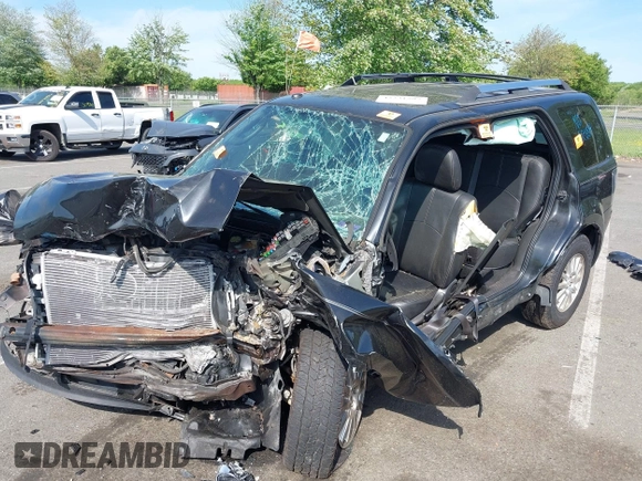 2011 Mercury Mariner Premier with VIN 4M2CN9HG7BKJ01459, listed as a IAAI auction lot 42231597 with 168,362 mi miles and . Bid and sale history available at DreamBid. Image 6.