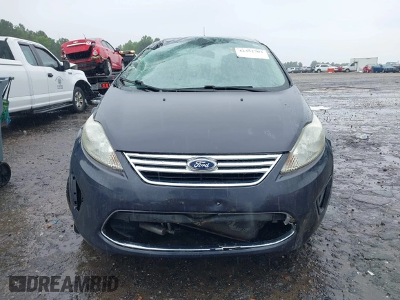 2012 Ford Fiesta SE z VIN 3FADP4BJ4CM155538, wystawiony jako IAAI lot #42352703 z przebiegiem 100 666 mil mil oraz . Historia ofert i sprzedaży dostępna na DreamBid. Obrazek 12.