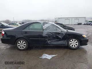 2003 Toyota Camry LE with VIN 4T1BE30K13U144114, listed as a IAAI auction lot 41829879 with 60,385 mi miles and . Bid and sale history available at DreamBid. Image 13.