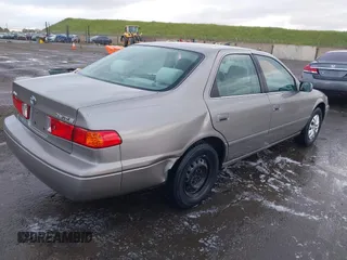 2000 Toyota Camry CE z VIN 4T1BG22K3YU691054, wystawiony jako IAAI lot #41896526 z przebiegiem 303 993 mil mil oraz . Historia ofert i sprzedaży dostępna na DreamBid. Obrazek 6.