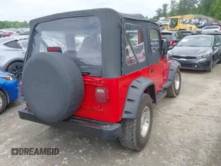 1999 Jeep Wrangler SE z VIN 1J4FY29P5XP487111, wystawiony jako IAAI lot #42125867 z przebiegiem 156 804 mil mil oraz . Historia ofert i sprzedaży dostępna na DreamBid. Obrazek 4.