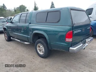 2000 Dodge Dakota Sport z VIN 1B7GG2AN4YS760836, wystawiony jako IAAI lot #42472312 z przebiegiem 230 401 mil mil oraz . Historia ofert i sprzedaży dostępna na DreamBid. Obrazek 3.