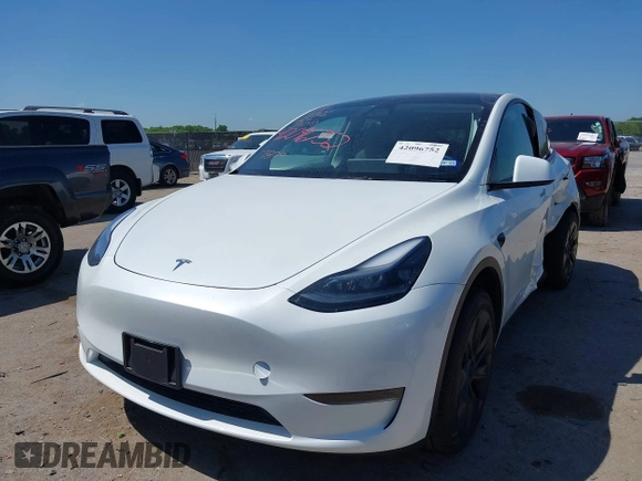 2024 Tesla Model Y with VIN 7SAYGDED0RA327806, listed as a IAAI auction lot 42096752 with 13,244 mi miles and . Bid and sale history available at DreamBid. Image 2.