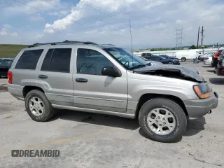 2000 Jeep Grand Cherokee Laredo with VIN 1J4GW48N1YC324356, listed as a Copart auction lot 62011305 with 242,322 mi miles and Salvage title. Bid and sale history available at DreamBid. Image 4.