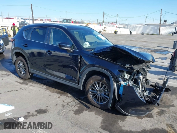 2019 Mazda CX-5 Touring with VIN JM3KFACM7K1534905, listed as a IAAI auction lot 41945607 with 56,014 mi miles. Bid and sale history available at carsss.com. Image 1.