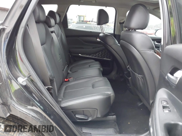 2019 Hyundai Santa Fe Ultimate with VIN 5NMS5CAA8KH019109, listed as a IAAI auction lot 41120391 with 101,829 mi miles and . Bid and sale history available at DreamBid. Image 8.