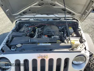 2012 Jeep Wrangler Sport z VIN 1C4AJWAG3CL151885, wystawiony jako Copart lot #51682175 z przebiegiem 111 544 mil mil oraz Szkoda całkowita • Salvage title. Historia ofert i sprzedaży dostępna na DreamBid. Obrazek 13.