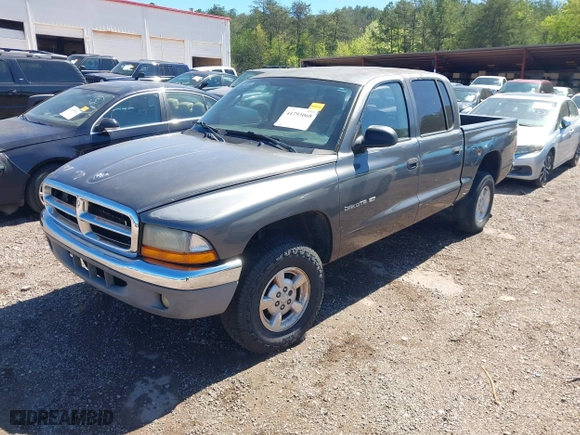2002 Dodge Dakota SLT with VIN 1B7HG48NX2S623588, listed as a IAAI auction lot 41793068 with 213,159 mi miles. Bid and sale history available at carsss.com. Image 2.