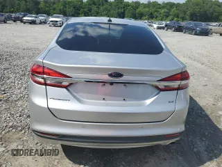 2017 Ford Fusion SE z VIN 3FA6P0H74HR164747, wystawiony jako Copart lot #56139855 z przebiegiem 105 769 mil mil oraz Szkoda całkowita • Salvage title. Historia ofert i sprzedaży dostępna na DreamBid. Obrazek 6.