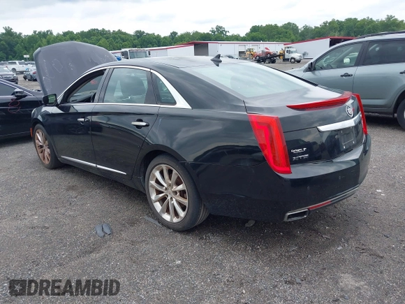 2013 Cadillac XTS Luxury z VIN 2G61P5S34D9183065, wystawiony jako IAAI lot #42665741 z przebiegiem 209 585 mil mil oraz . Historia ofert i sprzedaży dostępna na DreamBid. Obrazek 3.