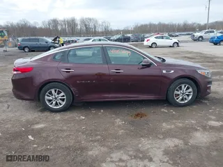 2016 Kia Optima LX with VIN 5XXGT4L36GG108599, listed as a IAAI auction lot 42065639 with 127,387 mi miles. Bid and sale history available at carsss.com. Image 13.
