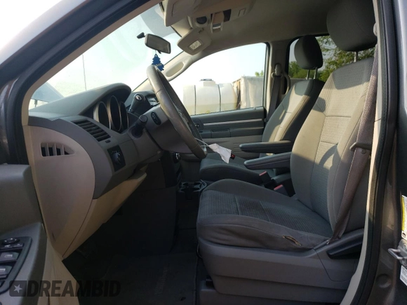 2009 Dodge Grand Caravan SE with VIN 2D8HN44E29R694728, listed as a Copart auction lot 60287565 with 233,018 mi miles and Clean title. Bid and sale history available at DreamBid. Image 7.