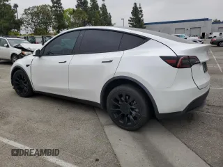 2021 Tesla Model Y Long Range with VIN 5YJYGDEE3MF214823, listed as a Copart auction lot 50738045 with 63,227 mi miles and Salvage Title. Bid and sale history available at DreamBid. Image 2.